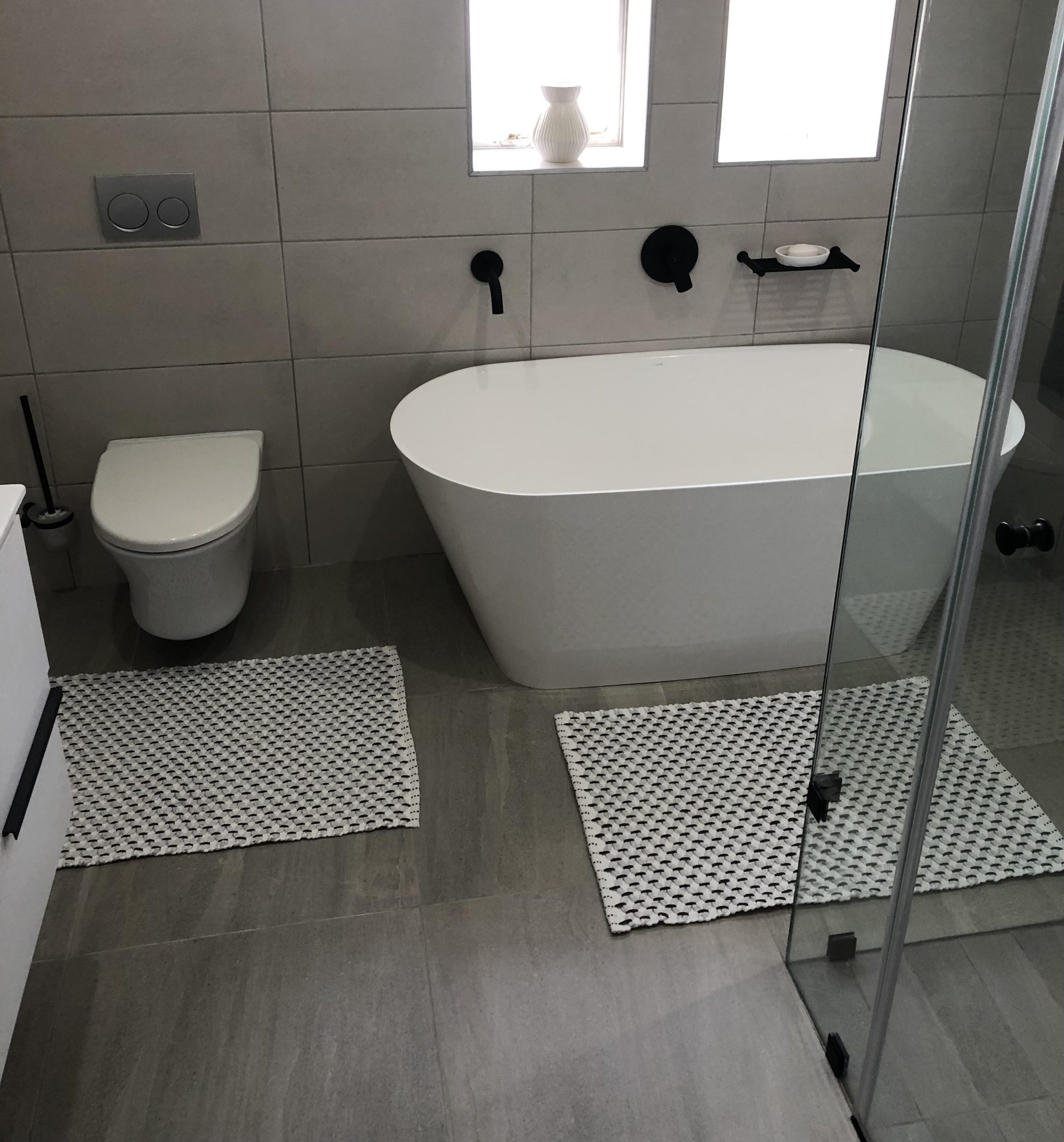 Completed bathroom renovation with modern finishes