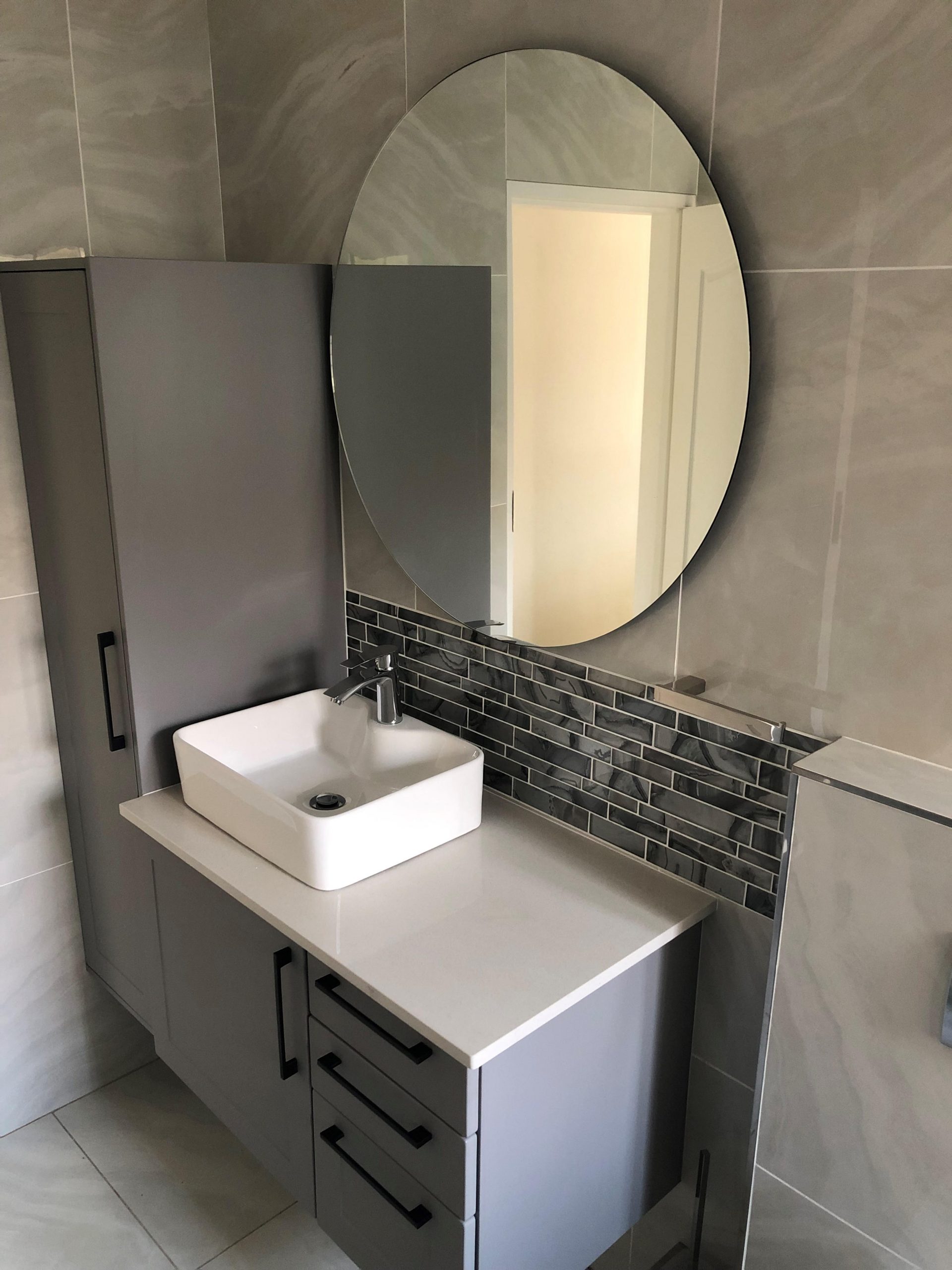 Completed bathroom renovation with modern finishes
