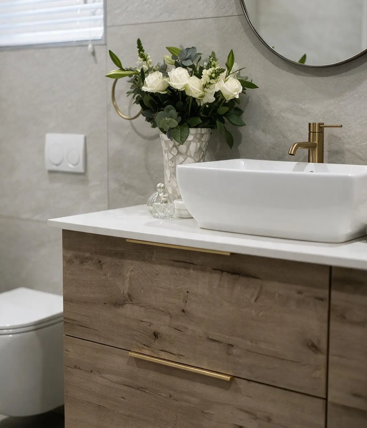 Bathroom renovation with double vanity, illuminated mirrors and modern finishes